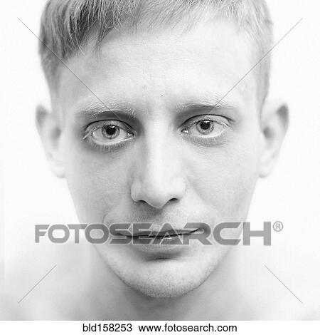 Close up of face of serious Caucasian man View Large Photo Image Stock Image - Close up of face of serious Caucasian man. Fotosearch