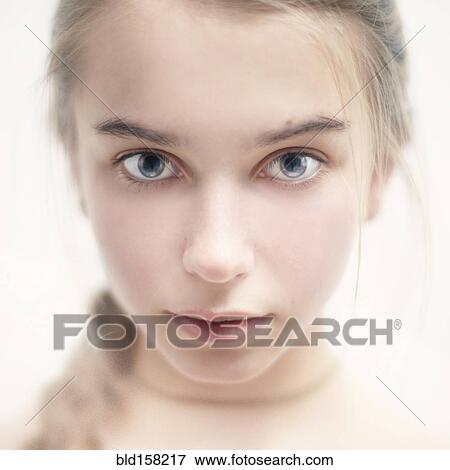 Stock Photo - Close up of face of serious Caucasian girl. Fotosearch