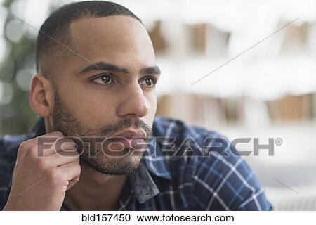 Close up of face of serious Hispanic man View Large Photo Image Stock Image - Close up of face of serious Hispanic man. Fotosearch