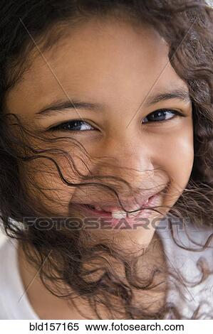 Close up of face of smiling mixed race girl View Large Photo Image Stock Photography - Close up of face of smiling mixed race girl. Fotosearch