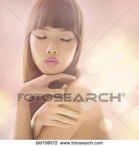 Stock Image - Close up of glamorous woman with eyes closed. Fotosearch