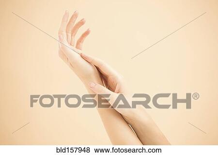 Close up of hands of woman rubbing View Large Photo Image Stock Photo - Close up of hands of woman rubbing. Fotosearch