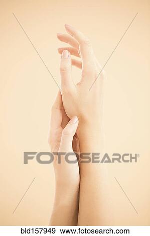Close up of hands of woman rubbing View Large Photo Image Stock Photo - Close up of hands of woman rubbing. Fotosearch