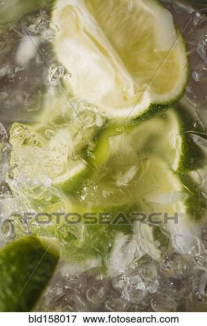 Close up of lime in iced drink View Large Photo Image Stock Photo - Close up of lime in iced drink. Fotosearch