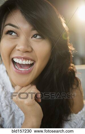 Close up of Pacific Islander woman laughing View Large Photo Image Stock Image - Close up of Pacific Islander woman laughing. Fotosearch