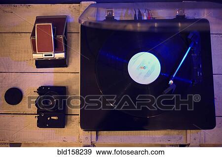 Stock Photo - Close up of record player and vintage cameras. Fotosearch