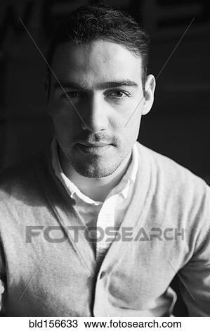 Stock Image - Close up of serious Caucasian man. Fotosearch