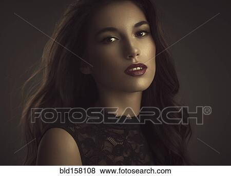 Close up of serious glamorous woman View Large Photo Image Stock Photo - Close up of serious glamorous woman. Fotosearch