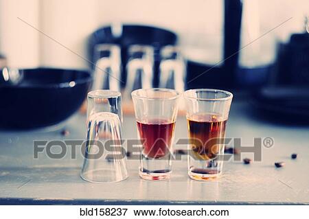 Close up of shot glasses on table View Large Photo Image Stock Photo - Close up of shot glasses on table. Fotosearch