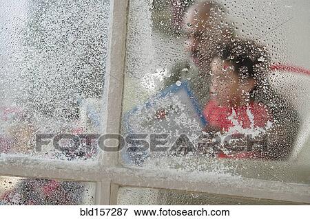 Close up of snow on window at Christmas View Large Photo Image Stock Photo - Close up of snow on window at Christmas. Fotosearch