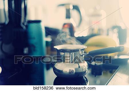 Close up of steam on pot cooking on stove View Large Photo Image Stock Photograph - Close up of steam on pot cooking on stove. Fotosearch