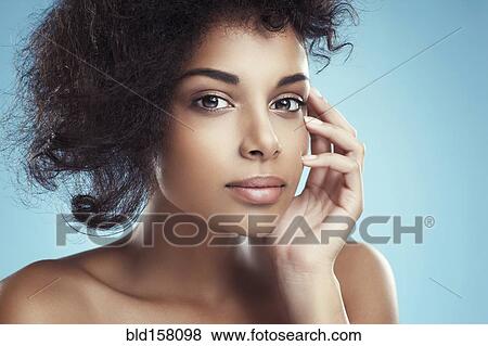 Close up of woman with curly hair View Large Photo Image Stock Photo - Close up of woman with curly hair. Fotosearch