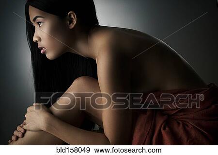Close up of woman wrapped in blanket View Large Photo Image Stock Photo - Close up of woman wrapped in blanket. Fotosearch