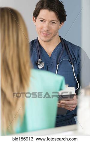 Doctor listening to patient View Large Photo Image Stock Image - Doctor listening to patient. Fotosearch