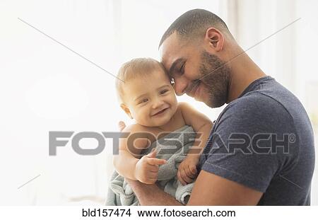 Father holding baby son View Large Photo Image Picture - Father holding baby son. Fotosearch
