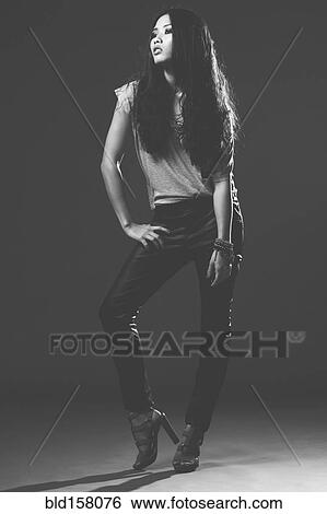 Stock Photograph - Glamorous woman in high heels with long hair. Fotosearch