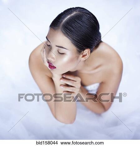 High angle view of glamorous woman wearing white gown View Large Photo Image Picture - High angle view of glamorous woman wearing white gown. Fotosearch