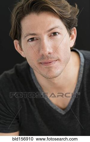 Stock Image - Hispanic man smiling. Fotosearch