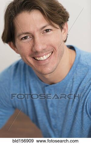 Stock Photo - Hispanic man smiling. Fotosearch