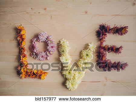 Stock Photo - Love spelled with flowers. Fotosearch