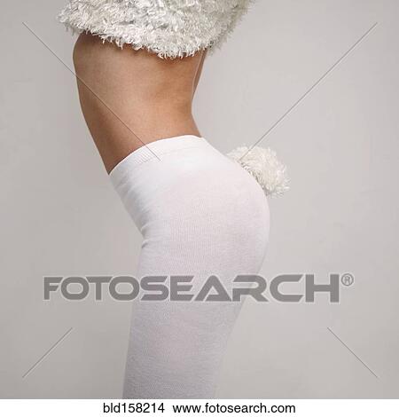 Picture - Midsection of Caucasian girl wearing rabbit costume. Fotosearch