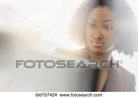 Mixed race businesswoman working at computer View Large Photo Image Picture - Mixed race businesswoman working at computer. Fotosearch
