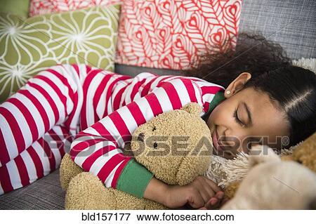 Mixed race girl sleeping on sofa View Large Photo Image Stock Photo - Mixed race girl sleeping on sofa. Fotosearch