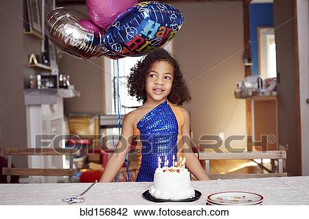 Mixed race girl with balloons and cake at party View Large Photo Image Stock Image - Mixed race girl with balloons and cake at party. Fotosearch
