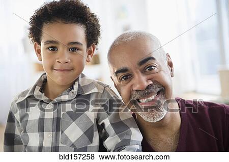 Mixed race grandfather and grandson smiling View Large Photo Image Stock Photo - Mixed race grandfather and grandson smiling. Fotosearch