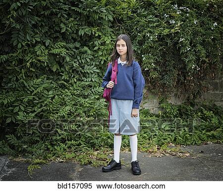 Mixed race schoolgirl in uniform with backpack View Large Photo Image Stock Photography - Mixed race schoolgirl in uniform with backpack. Fotosearch