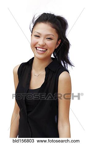 Stock Image - Mixed race teenage girl smiling. Fotosearch