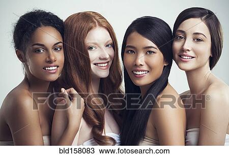 Multi-ethnic smiling women posing together View Large Photo Image Stock Image - Multi-ethnic smiling women posing together. Fotosearch