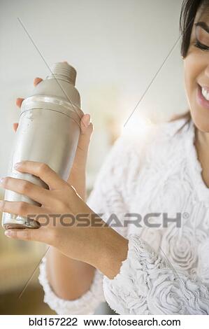 Pacific Islander woman shaking cocktail shaker View Large Photo Image Stock Image - Pacific Islander woman shaking cocktail shaker. Fotosearch