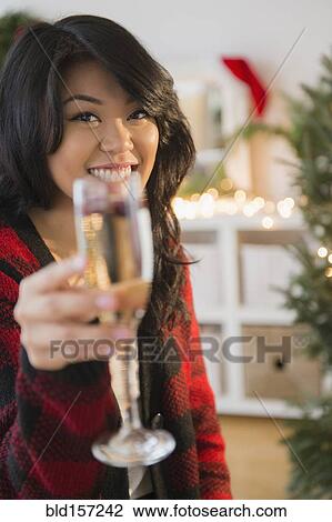 Pacific Islander woman toasting Christmas with champagne View Large Photo Image Stock Image - Pacific Islander woman toasting Christmas with champagne. Fotosearch