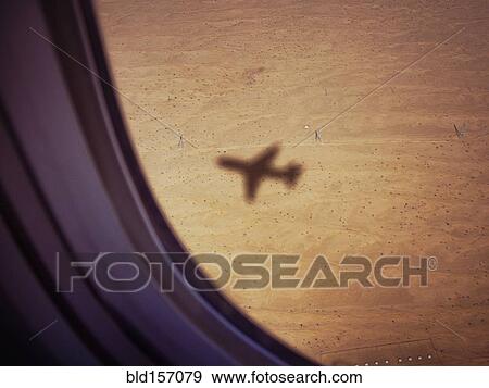 Shadow of airplane on desert ground View Large Photo Image Stock Photo - Shadow of airplane on desert ground. Fotosearch