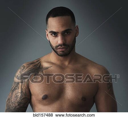Shirtless Hispanic man with tattoos View Large Photo Image Stock Photo - Shirtless Hispanic man with tattoos. Fotosearch