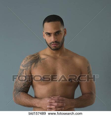 Shirtless Hispanic man with tattoos View Large Photo Image Stock Photo - Shirtless Hispanic man with tattoos. Fotosearch