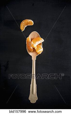 Spoon with orange slices View Large Photo Image Stock Photograph - Spoon with orange slices. Fotosearch