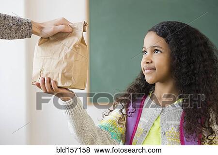 Student taking brown bag lunch in classroom View Large Photo Image Stock Photo - Student taking brown bag lunch in classroom. Fotosearch