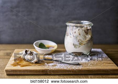 Tiramisu dessert with powdered sugar, sauce and spoon View Large Photo Image Stock Image - Tiramisu dessert with powdered sugar, sauce and spoon. Fotosearch