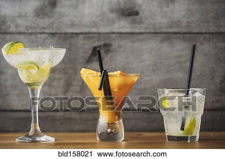 Stock Image - Variety of fruit cocktail drinks. Fotosearch