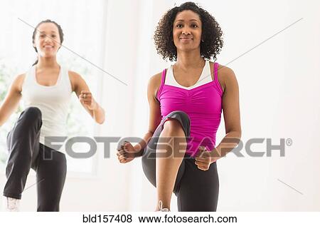 Women working out in exercise class View Large Photo Image Stock Photo - Women working out in exercise class. Fotosearch