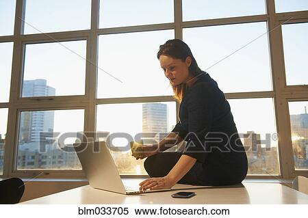 Caucasian businesswoman using laptop in office View Large Photo Image Stock Photography - Caucasian businesswoman using laptop in office. Fotosearch