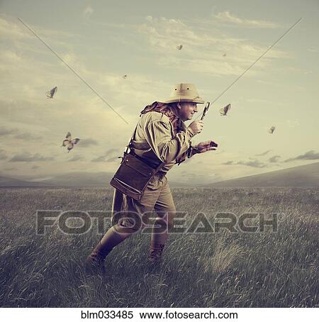 Caucasian hunter examining butterfly with magnifying glass View Large Photo Image Stock Photography - Caucasian hunter examining butterfly with magnifying glass. Fotosearch