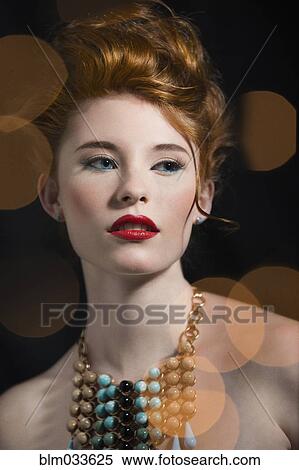 Stock Photography - Caucasian woman with glamorous make-up and necklace. Fotosearch