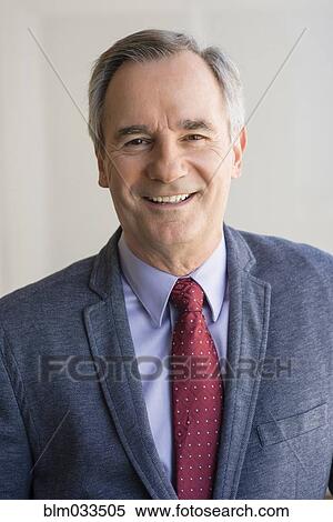 Stock Photography - Close up of Caucasian businessman smiling. Fotosearch