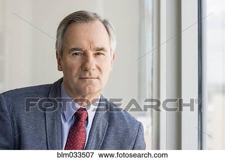Stock Photo - Close up of serious Caucasian businessman. Fotosearch