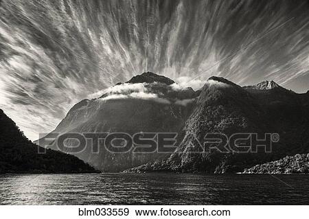 Forested mountains over remote river, Te Anau, Southland, New Zealand View Large Photo Image Stock Photo - Forested mountains over remote river, Te Anau, Southland, New Zealand. Fotosearch