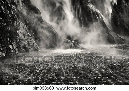 High angle view of waterfall flowing into remote river View Large Photo Image Stock Image - High angle view of waterfall flowing into remote river. Fotosearch