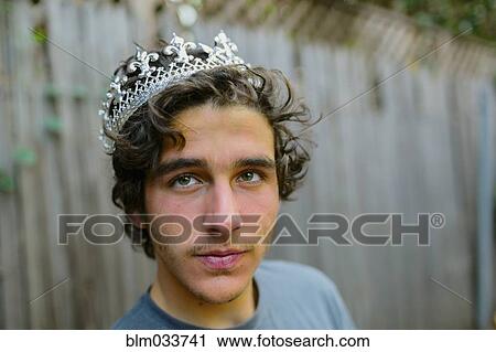 Hispanic man wearing crown in backyard View Large Photo Image Stock Image - Hispanic man wearing crown in backyard. Fotosearch